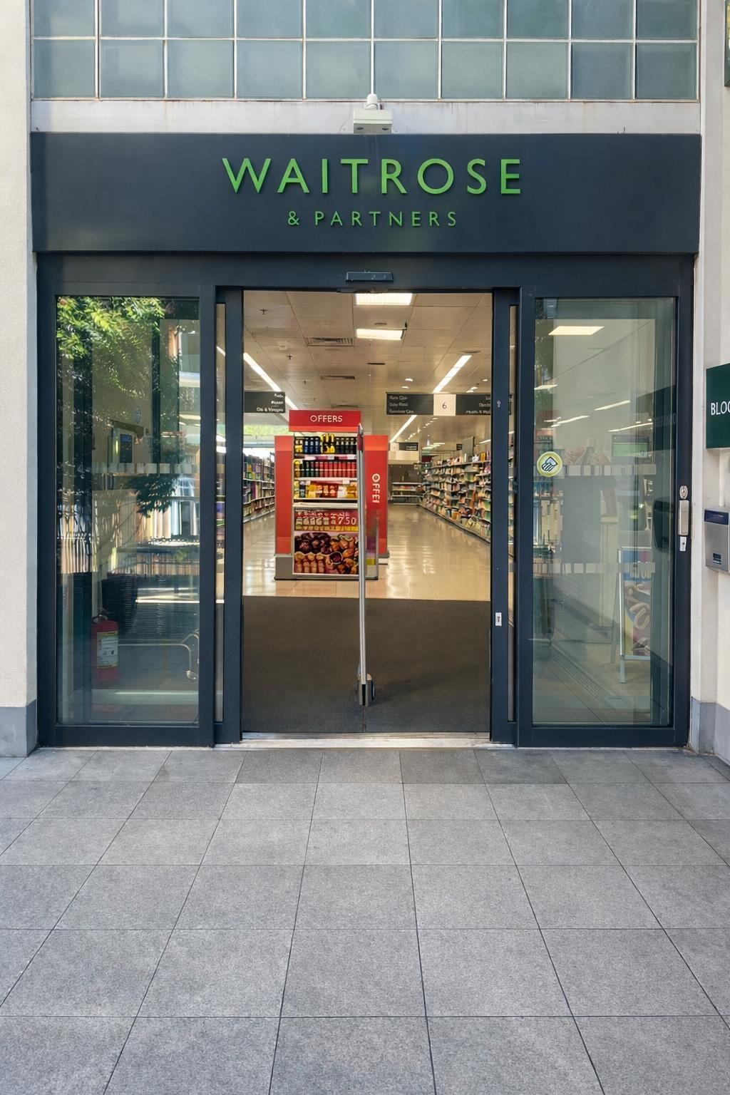 Automatic sliding entrance doors installed at a supermarket shop front